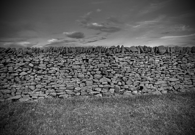 Black and white shot of a traditional dry stone wall.